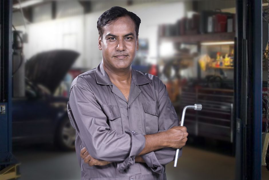 Professional auto glass technician smiling
