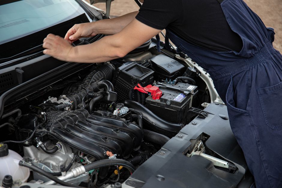 Technician repairing a windshield chip